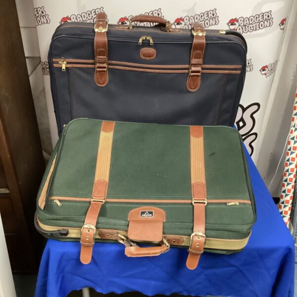Vintage brown suitcase with distinctive antler handles for collectors.
