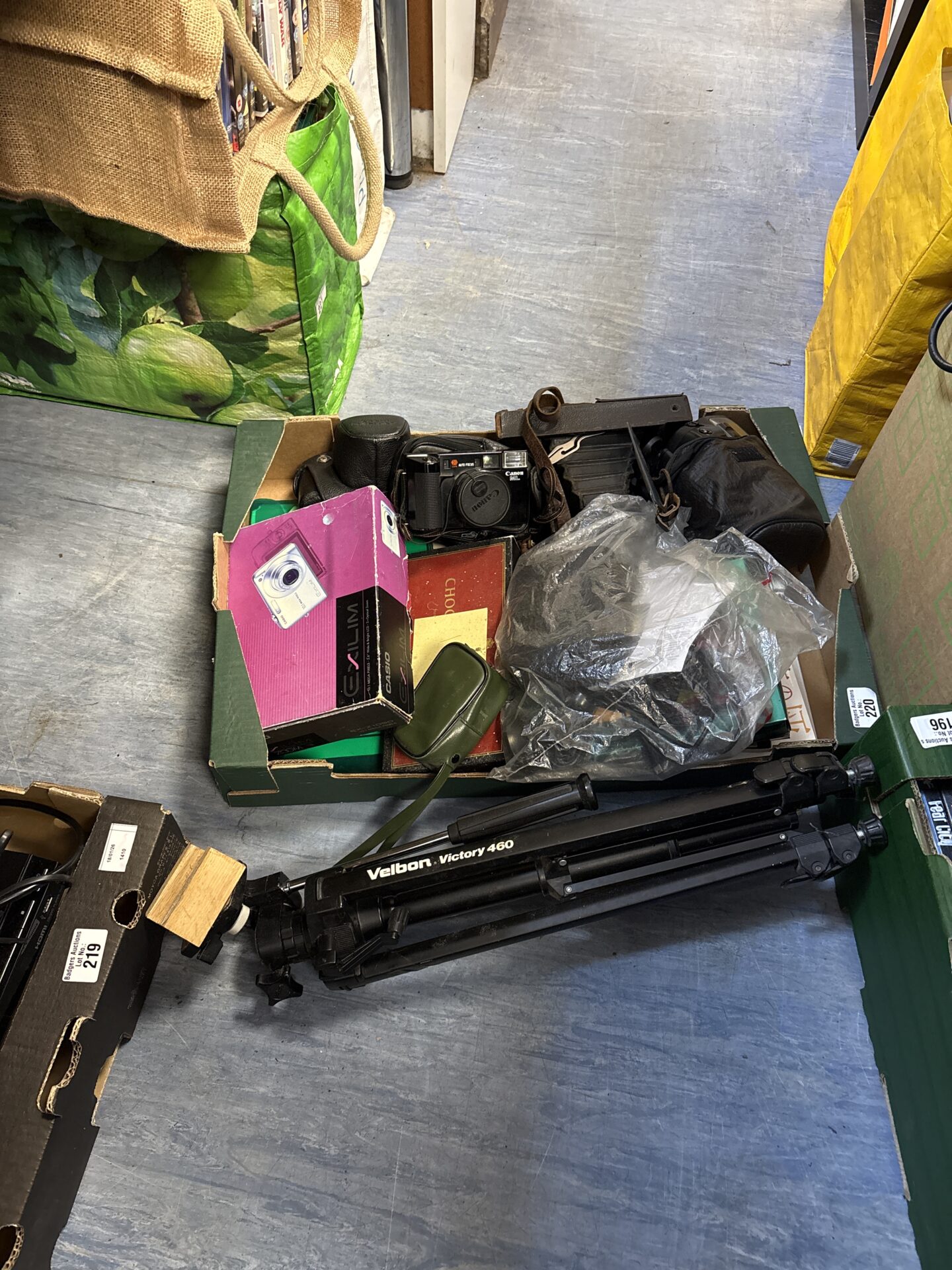 220 Box of cameras and binoculars, including tasco and Canon