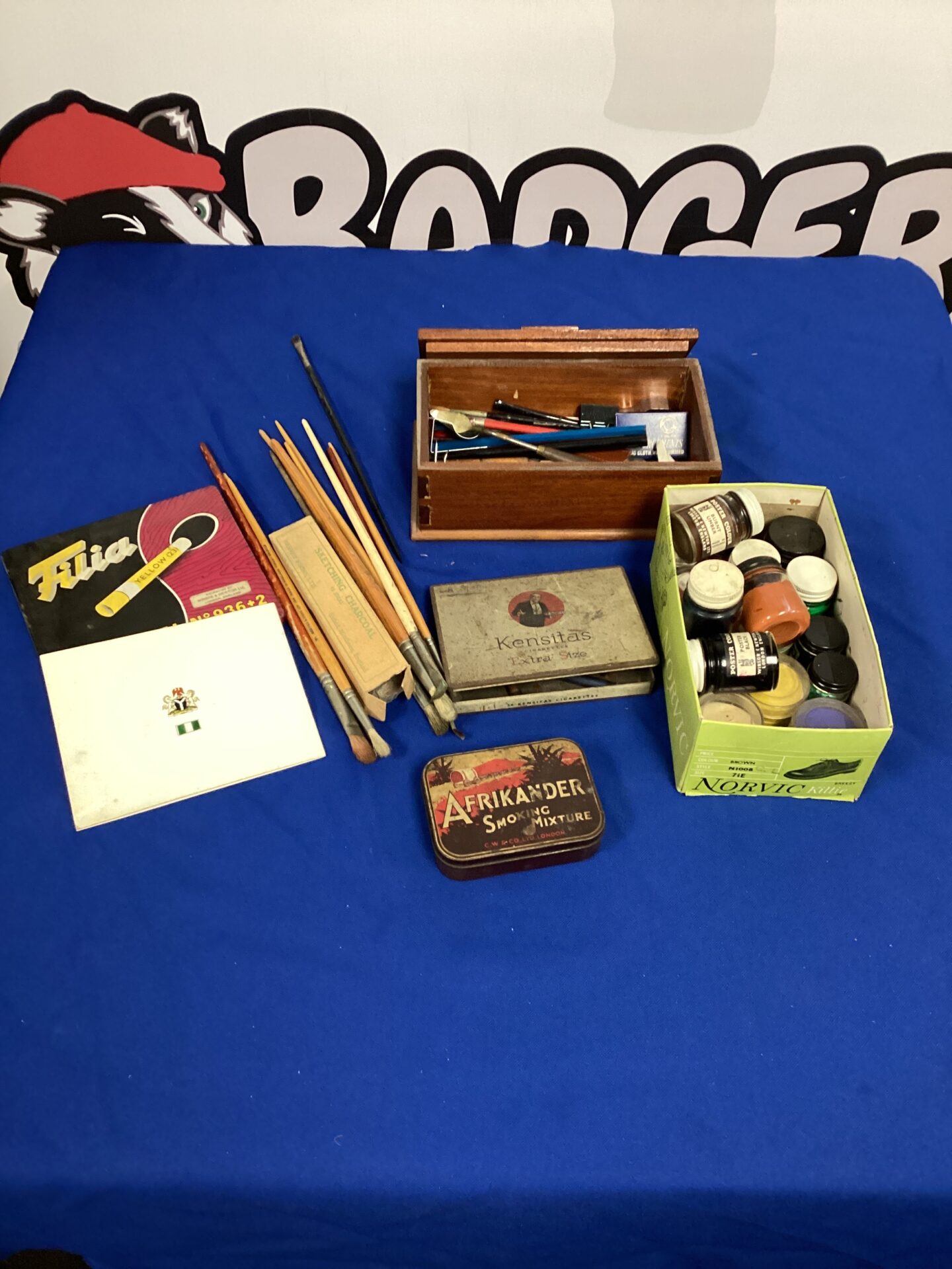 598 A box of vintage car supplies, including paintbrushes paints and crafting materials