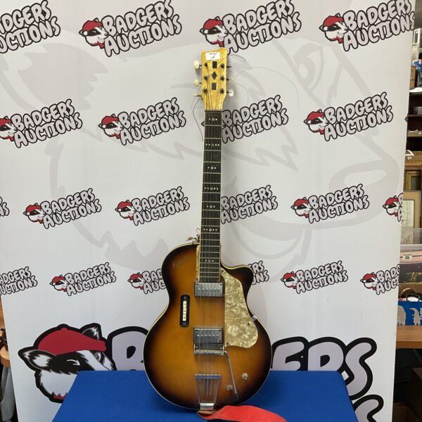 Front view of a vintage electric guitar with a sunburst finish.