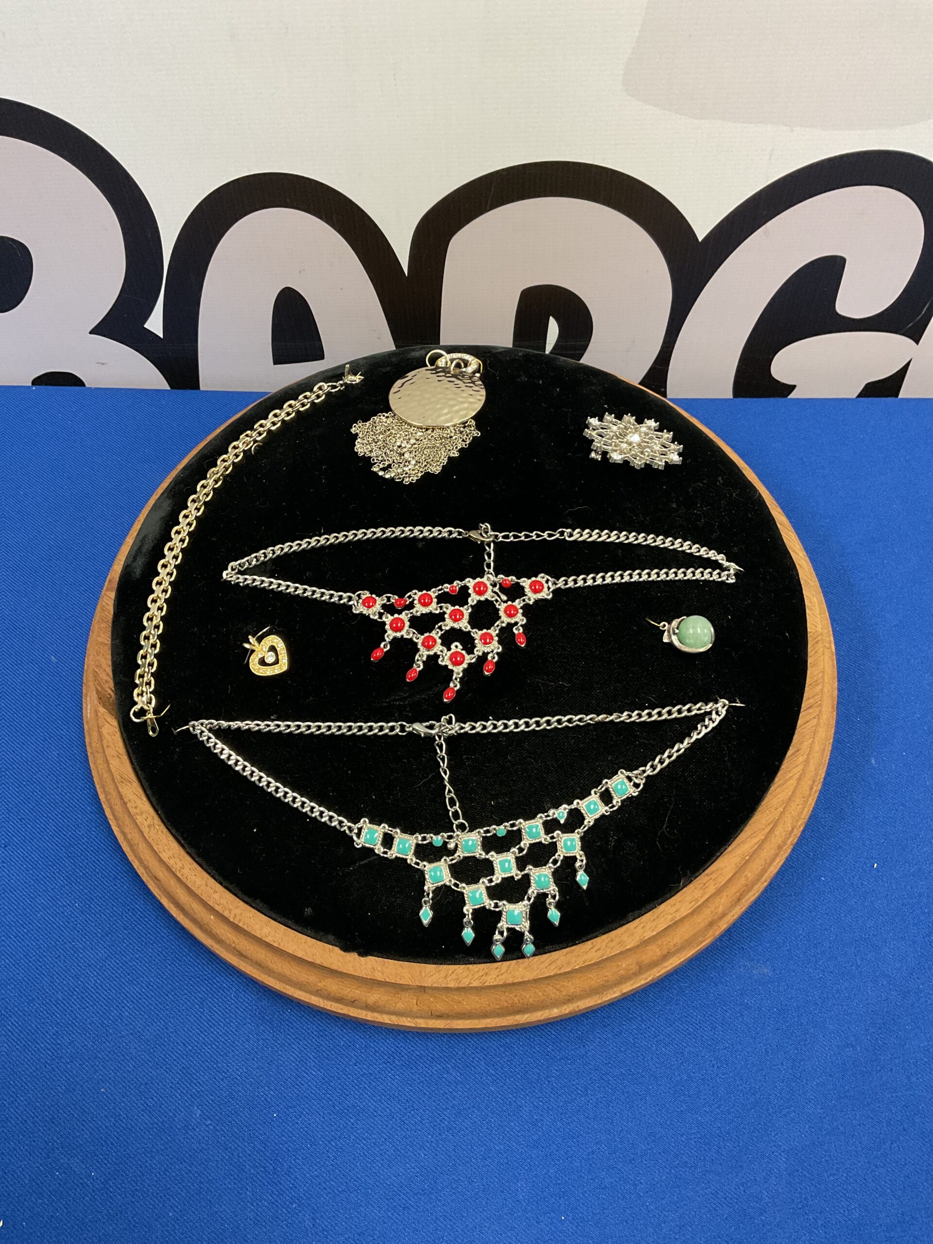 004 Wood framed Jewellery display cushion with selection of jewellery