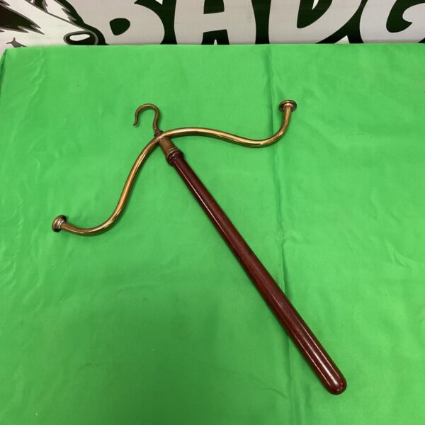 Vintage brass judges wig and cloak hanger with wood handle.