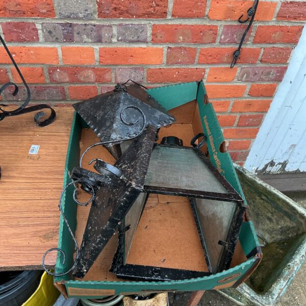Pair of weathered vintage metal porch lights for garden or exterior use.