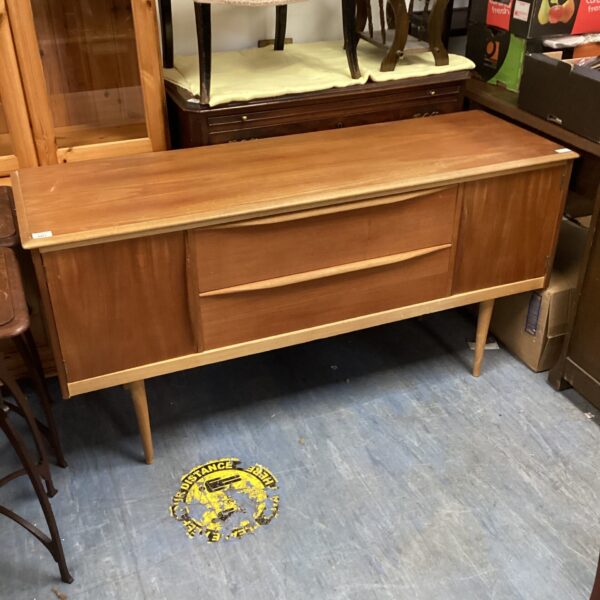 Vintage pine sideboard with drawers and cabinet doors.