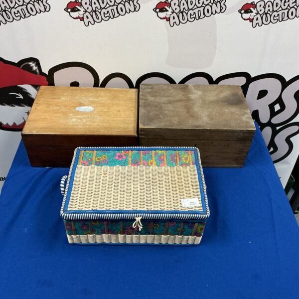 Group of three vintage sewing boxes with colourful details.