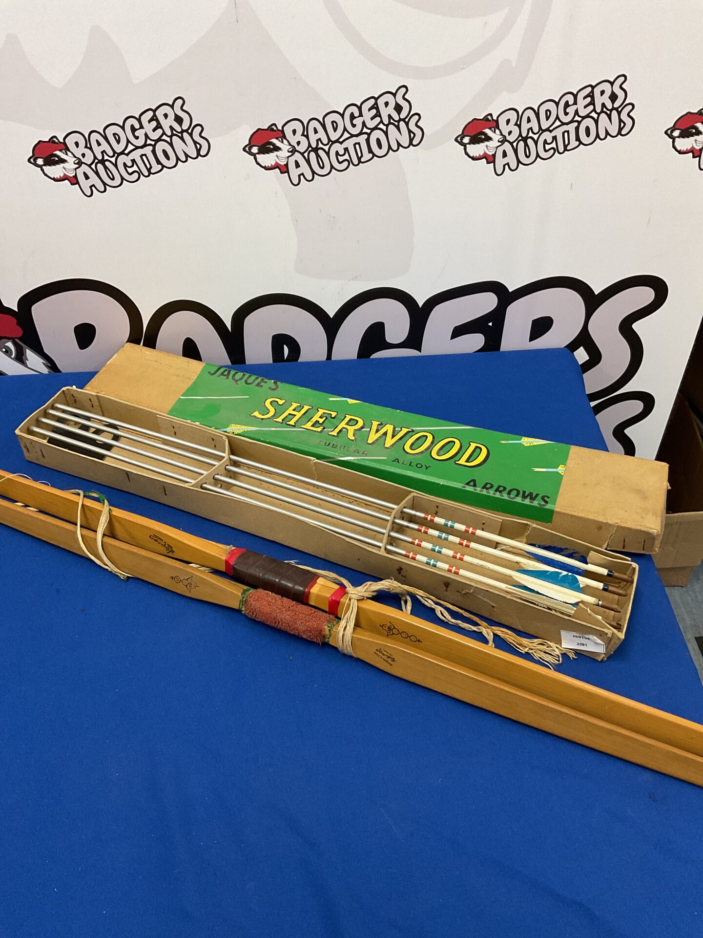 734 Two vintage slazenger long bows & box of arrows