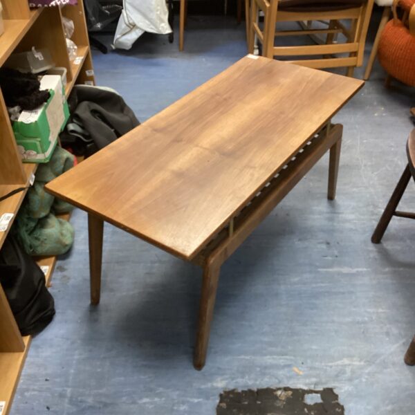 Vintage Slough teak coffee table with magazine rack.