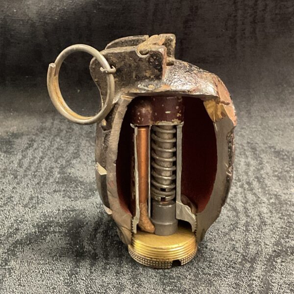 WWII hand grenade cutaway showing internal components.