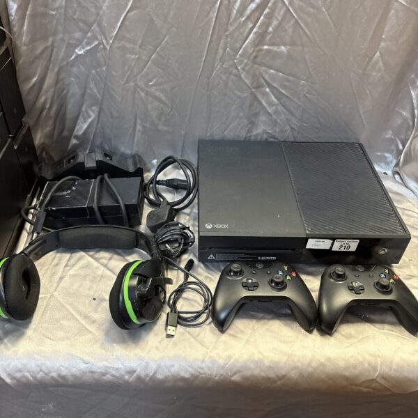 Microsoft Xbox One console with included controllers and gaming headset.