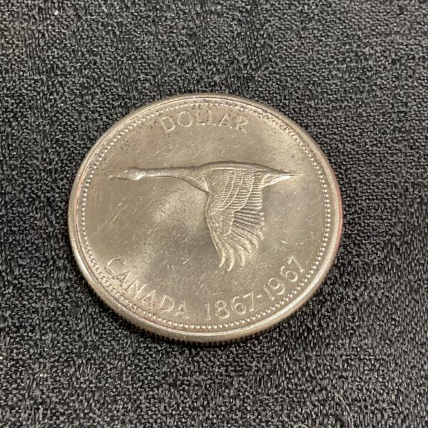 1967 Canadian Silver Dollar featuring a flying goose design.