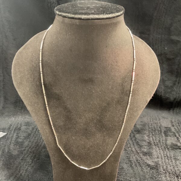 Polished 925 silver bar link necklace on display.