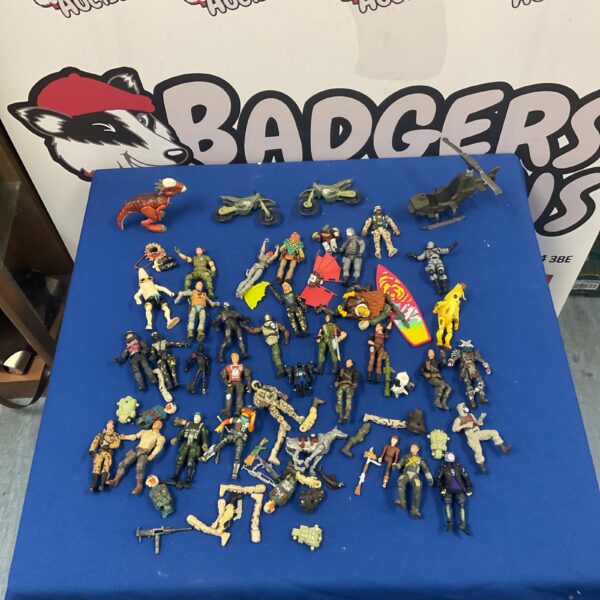Mixed lot of action figures including Fortnite characters for collectors.