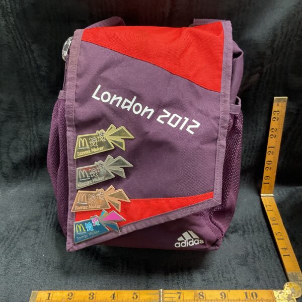 Adidas London 2012 rucksack with Games Maker badges, Olympic memorabilia.