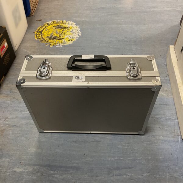 Silver aluminium flight case with handle and locking mechanism.