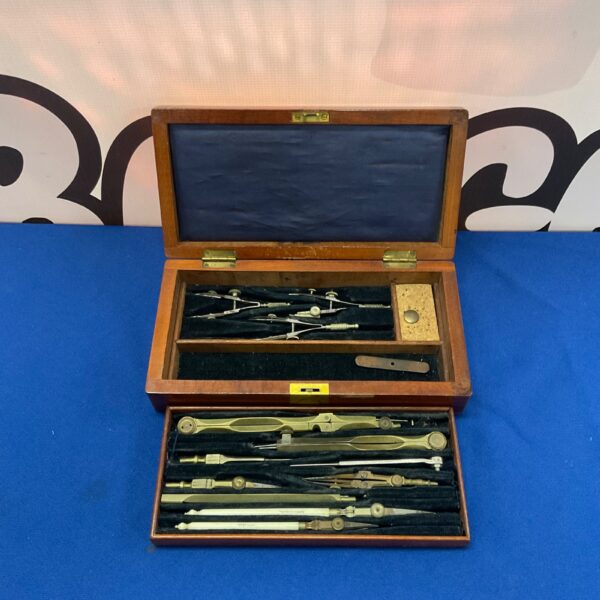 Antique brass compasses in a fitted wooden case, 1917.