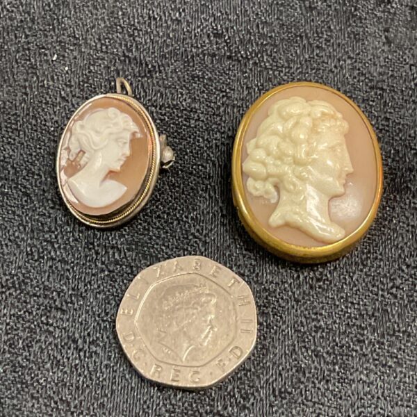 Silver antique cameo brooch with a classical portrait profile.