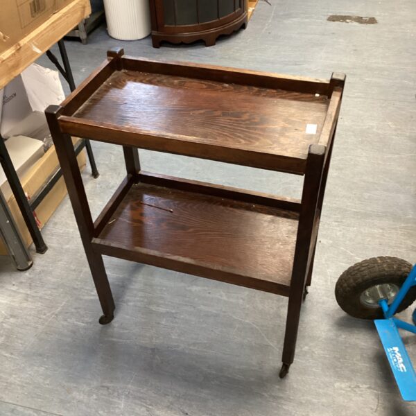 Antique Morgan serving trolley with two tiers and wooden construction.