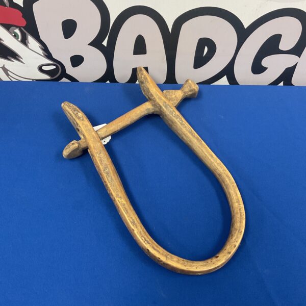 Antique wooden calf yoke, a vintage farm tool for animal restraint.