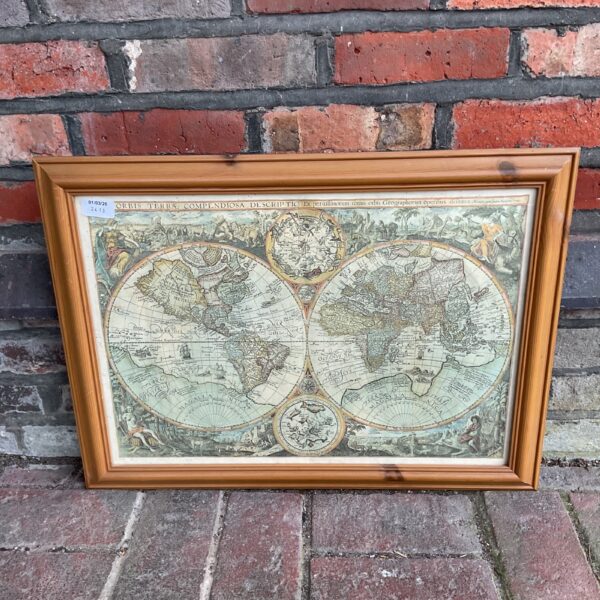 Framed antique world map reproduction for vintage home decor.