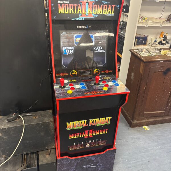 Arcade1Up Mortal Kombat II arcade machine with cracked screen.