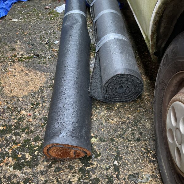 Two rolls of artificial grass for garden landscaping.