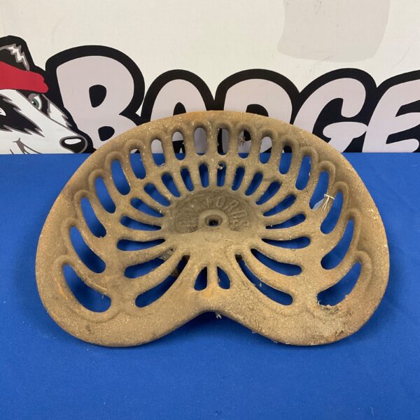 Antique Bamfords tractor seat, cast iron, vintage farm equipment.