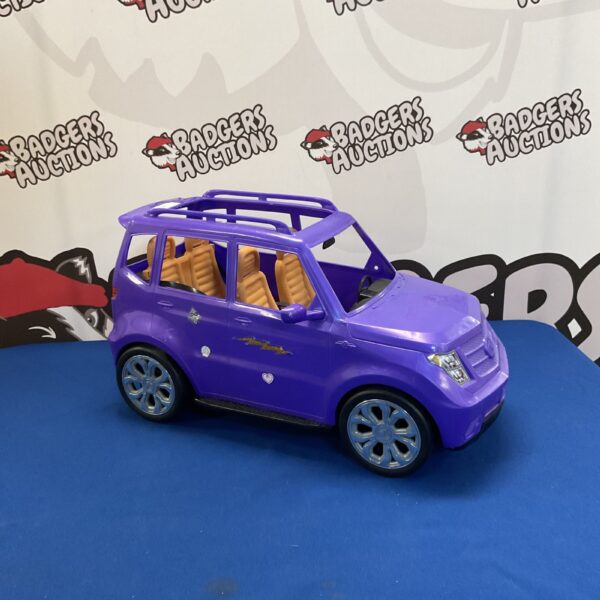 Pink Barbie Jeep toy car for dolls, collectible vehicle.