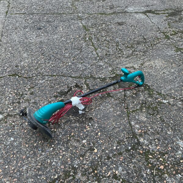 Bosch electric garden strimmer for lawn edging and maintenance.