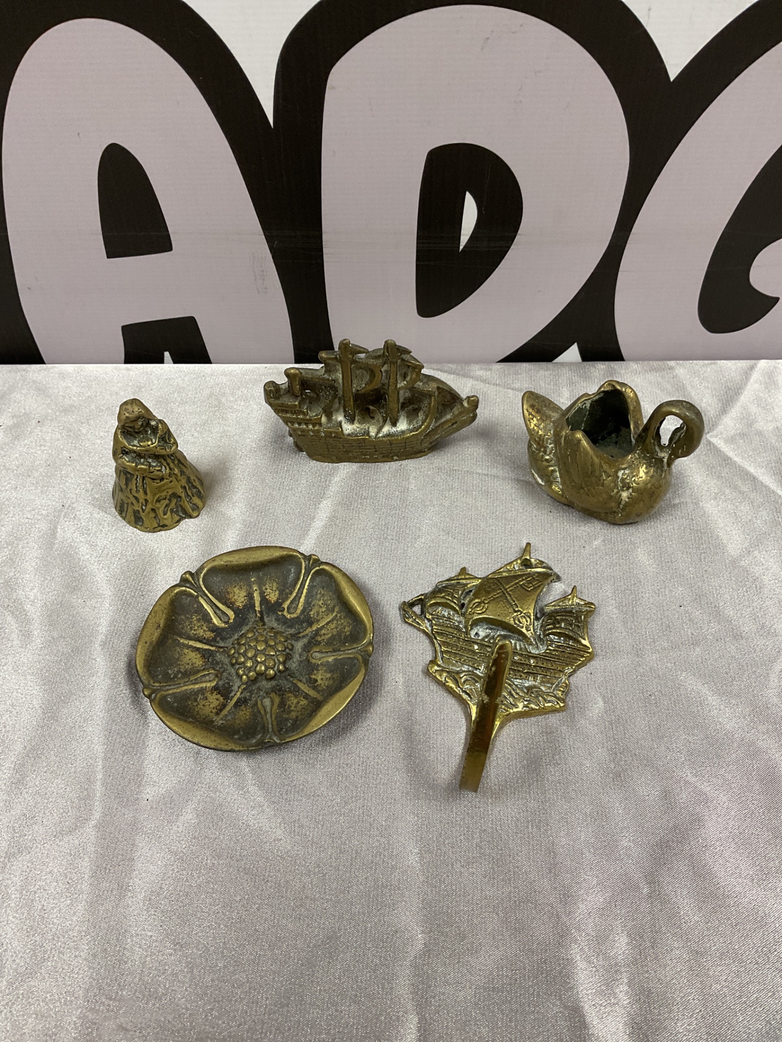 041 Brass ship paperweight, coathook, swan candlestick holder & English rose dish