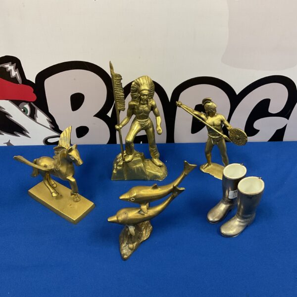 Vintage brass figurine collection featuring Native American, Spartan, dolphin, and Pegasus.