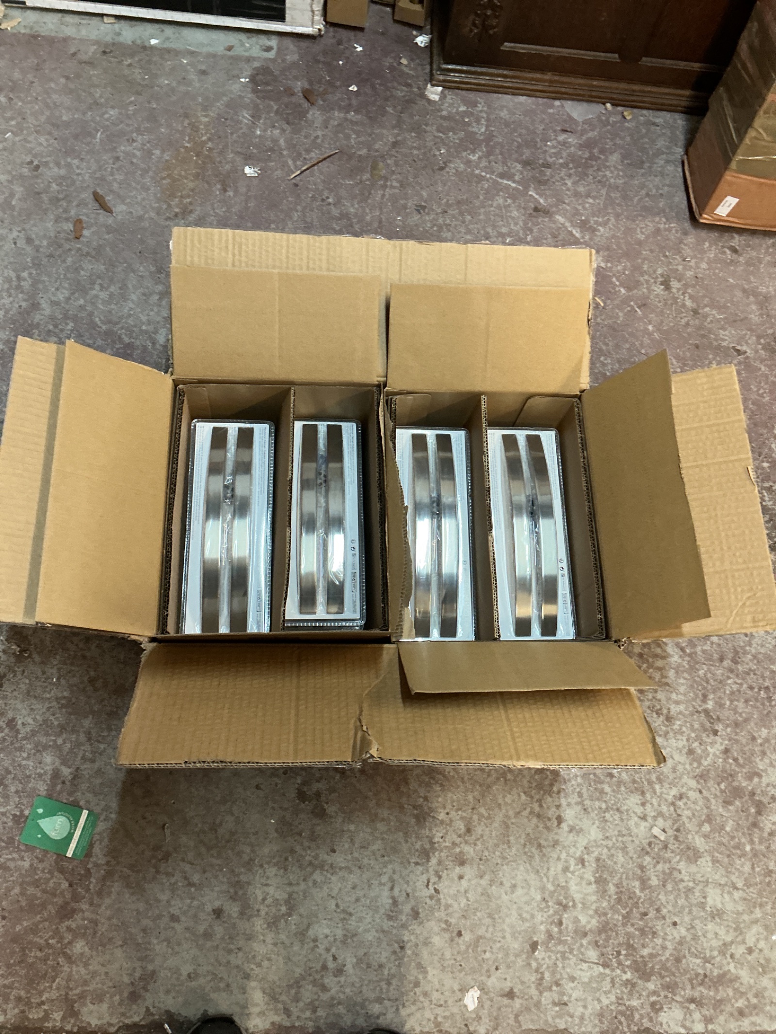 1131 Two boxes of brushed steel handles