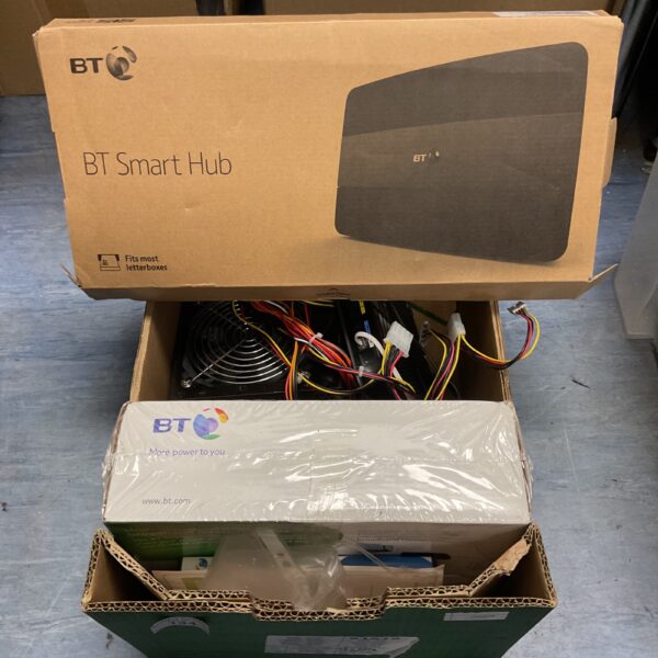 Box of BT WiFi routers and power supplies for home networking.