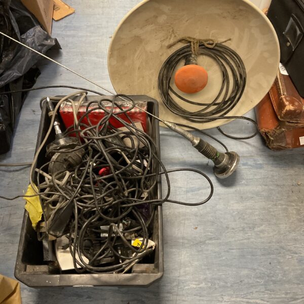Collection of vintage CB radio accessories and antennas.
