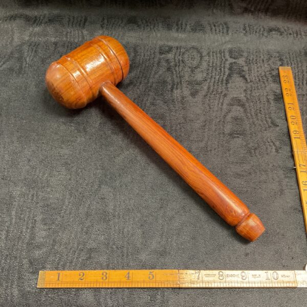Vintage wooden cricket mallet hammer for sports and ground work.