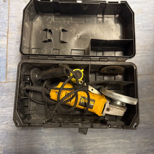 Dewalt angle grinder in storage case, power tool for metalworking.