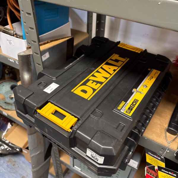 Empty Dewalt XR tool case for tool storage and transport.