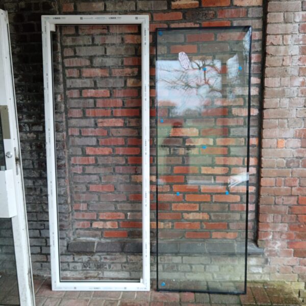 White framed double glazed window measuring 705x2040mm.