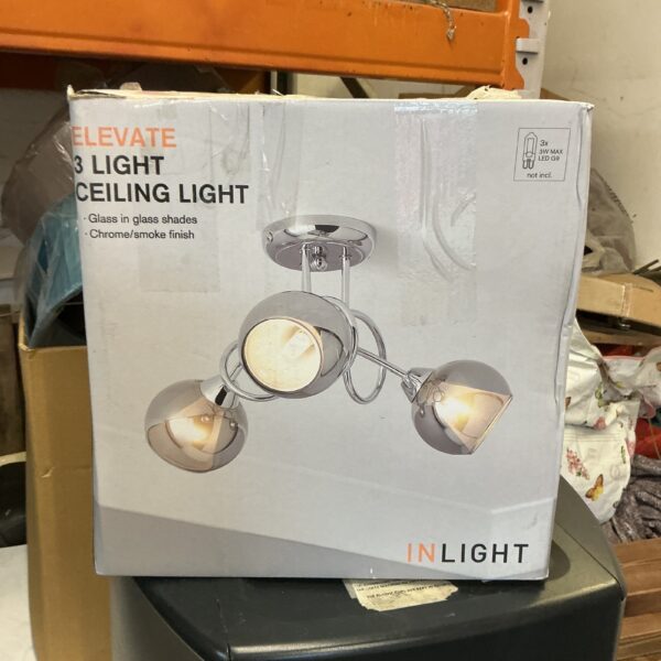Chrome three-head adjustable ceiling light, the ‘Elevate’ model.