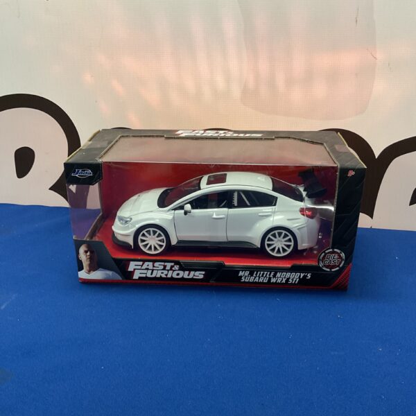Fast and Furious Subaru WRX STI diecast model in packaging.