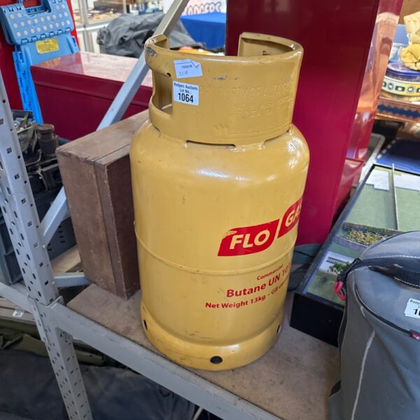 Empty Flo gas patio gas canister for outdoor use.