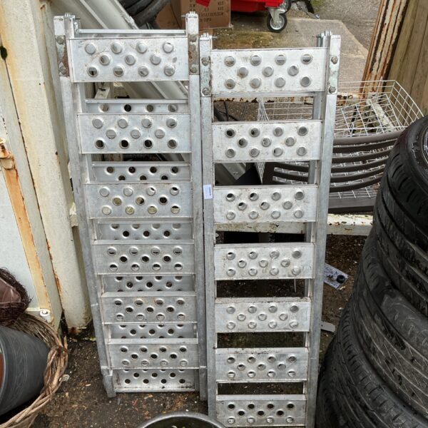 Two folding aluminium ramps in used condition, ideal for loading or access.