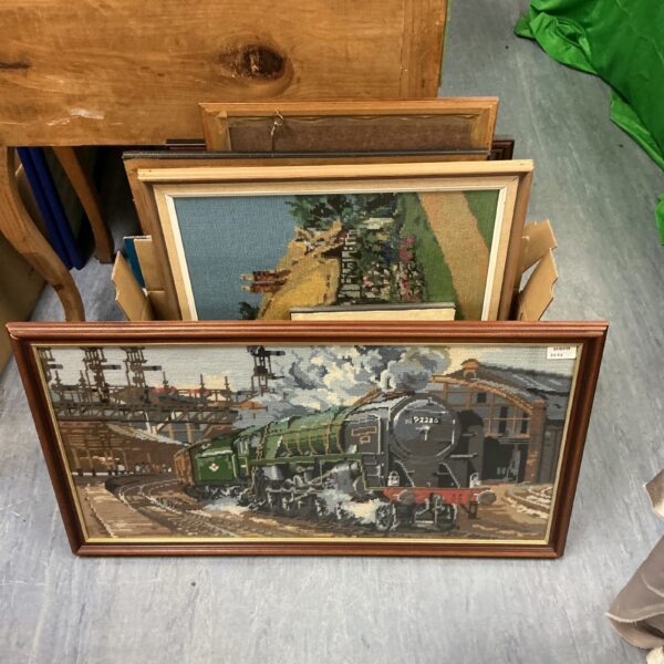 Vintage framed embroidery of a steam train, detailed railway art.