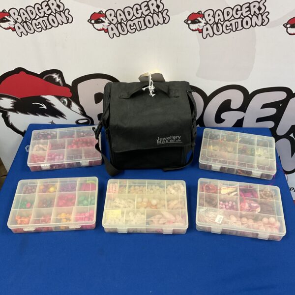 Colourful gemstone jewellery making case with five trays.