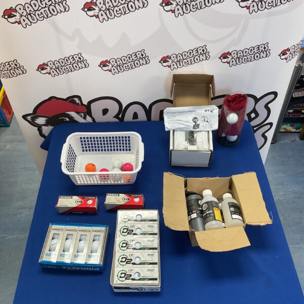 Mixed lot of golf balls and BT Vision powerline adapters.