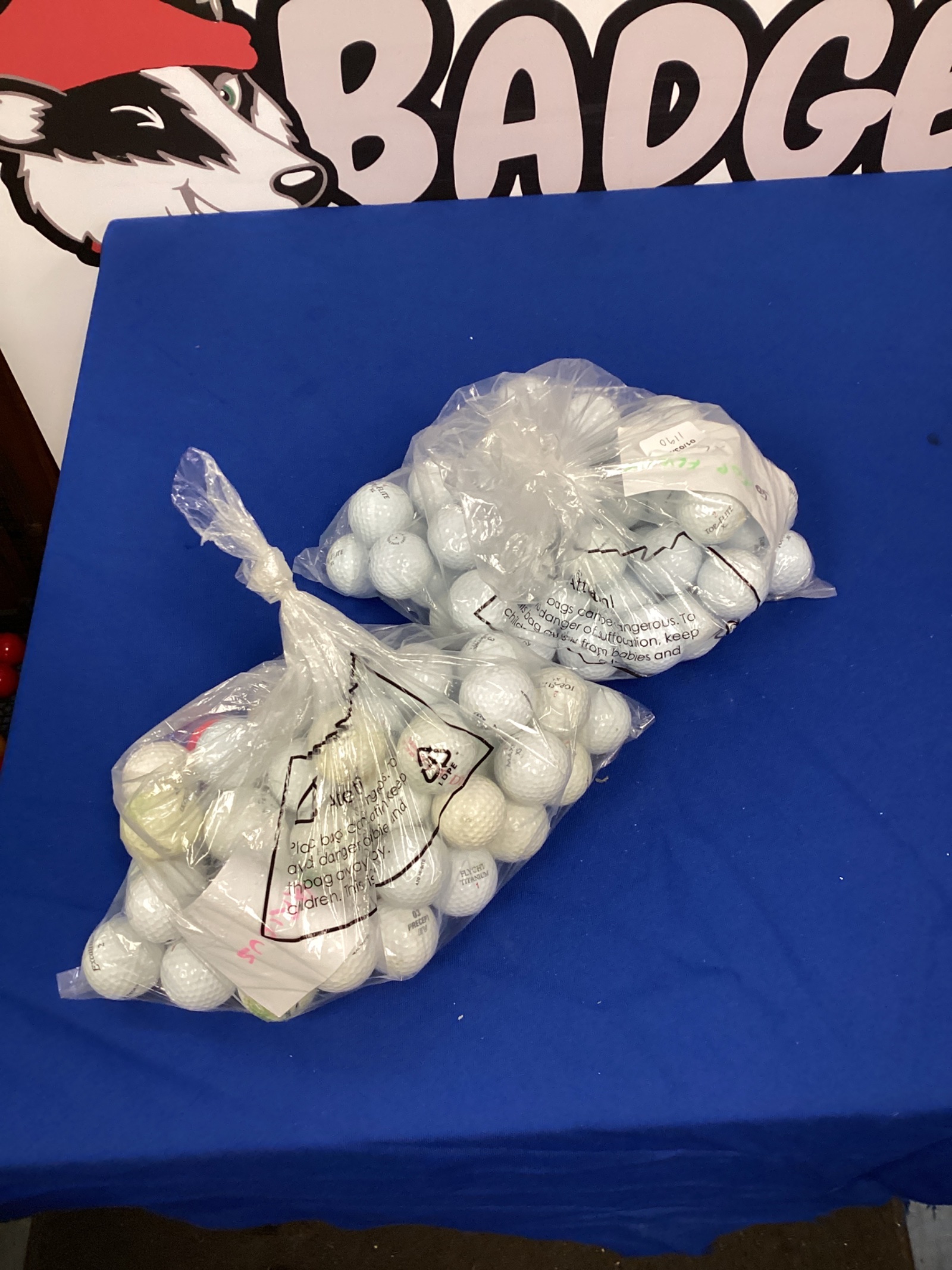 694 Two bags of golf balls inc 50 top flight & 50 mixed balls