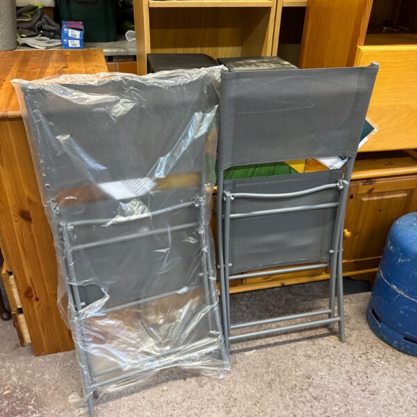 Two new Goodhome Saba metal garden chairs in packaging.