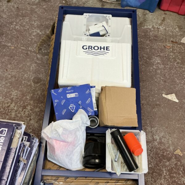Grohe concealed cistern kit in original packaging, bathroom plumbing.