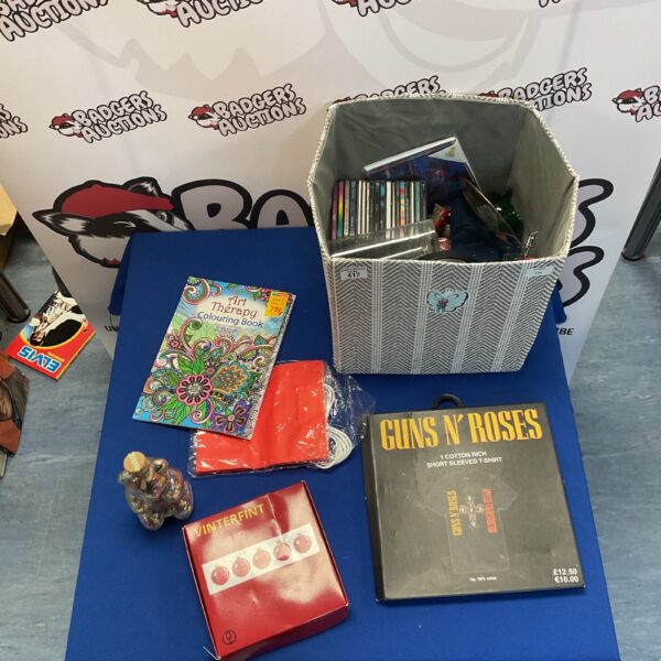 Mixed lot featuring a Guns N Roses t-shirt and assorted CDs.
