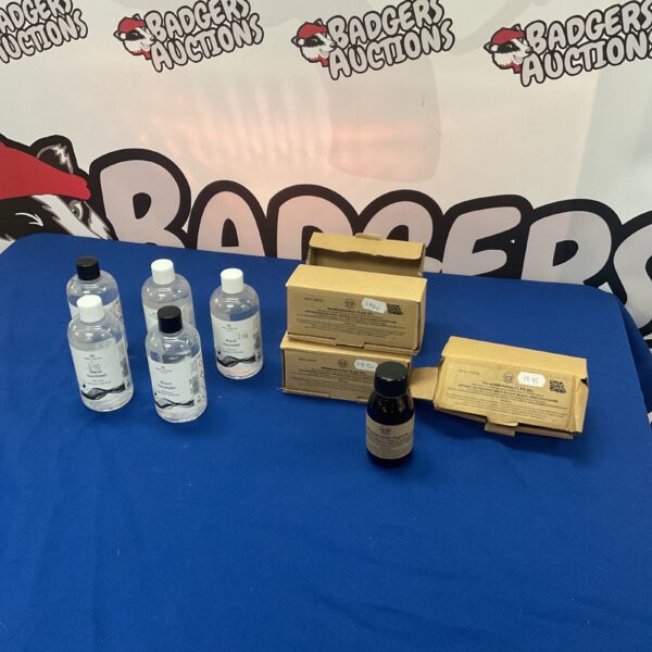 Hand sanitizer and flax oil bottles in a lot for collectors.