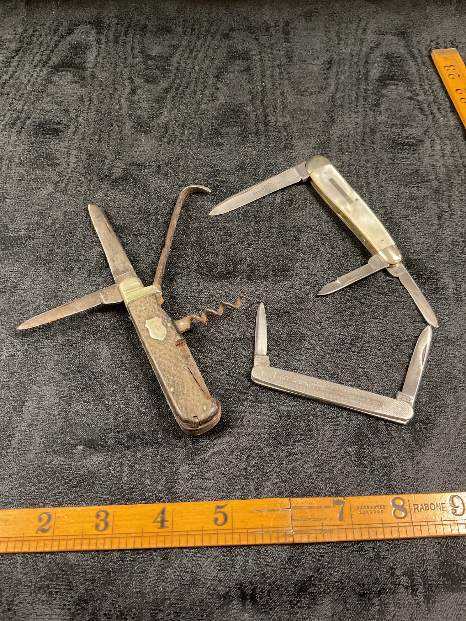 854 Three vintage pocket knife, including a nest knife and a Winfield multitool knife